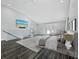Bright main bedroom with vaulted ceilings, dark floors, a sitting area and access to the outdoors at 3376 S Seclusion Dr, Sarasota, FL 34239
