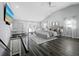 Spacious main bedroom features vaulted ceilings, dark floors, sitting area, and access to the outdoors at 3376 S Seclusion Dr, Sarasota, FL 34239