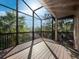 Expansive screened patio showcasing ample space and serene outdoor views under a clear blue sky at 3376 S Seclusion Dr, Sarasota, FL 34239