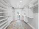 Large walk-in closet with custom shelving and drawers, providing ample storage space at 3376 S Seclusion Dr, Sarasota, FL 34239