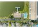 Overhead view of condo, pool, pier, and surrounding neighborhood showing proximity to waterfront at 3424 Lake Bayshore Dr # 405, Bradenton, FL 34205