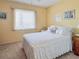 Bright and airy bedroom featuring a cozy bed, neutral-toned walls, and a window with natural light at 3424 Lake Bayshore Dr # 405, Bradenton, FL 34205