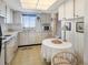 Efficient kitchen features white cabinets and appliances, perfect for everyday meal preparation and cozy dining at 3424 Lake Bayshore Dr # 405, Bradenton, FL 34205