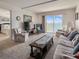 Comfortable living room featuring large window with water view, and cozy furnishings at 3424 Lake Bayshore Dr # 405, Bradenton, FL 34205