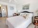 Serene bedroom with white linens, soft lighting, and tranquil decor for a restful retreat at 3424 Lake Bayshore Dr # 405, Bradenton, FL 34205