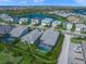 Aerial view of a home with a private screened-in pool, backyard and neatly manicured landscaping at 3442 Chestertown Loop, Bradenton, FL 34211