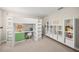 Bedroom with carpeted floors, bunk beds with integrated desk and shelves, plus cube storage at 3442 Chestertown Loop, Bradenton, FL 34211