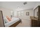 Cozy bedroom with carpeted floors, natural light, and en-suite bathroom at 3442 Chestertown Loop, Bradenton, FL 34211