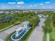 Scenic aerial view of the Mallory Park community entrance with lush landscaping and welcoming fountain feature at 3442 Chestertown Loop, Bradenton, FL 34211