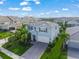 Charming two-story home showcasing a paved driveway, lush lawn, and well-maintained landscaping in a vibrant neighborhood at 3442 Chestertown Loop, Bradenton, FL 34211