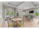 Clubhouse lounge area features a kitchen with barstool seating, microwave and dining table with seating at 3442 Chestertown Loop, Bradenton, FL 34211