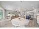 Bright and airy open concept living space with a modern kitchen, dining area, and living room at 3442 Chestertown Loop, Bradenton, FL 34211