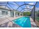 Relaxing outdoor pool and spa with screened enclosure offers a perfect backyard oasis at 3442 Chestertown Loop, Bradenton, FL 34211