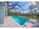 Screened-in pool with brick patio and attached spa offers a relaxing outdoor retreat at 3442 Chestertown Loop, Bradenton, FL 34211