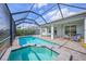 Outdoor pool and spa with screened enclosure offers the ultimate backyard retreat at 3442 Chestertown Loop, Bradenton, FL 34211