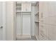 Spacious walk-in closet features shelving, hanging space and several built in drawers at 3442 Chestertown Loop, Bradenton, FL 34211