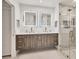 Modern bathroom featuring double sinks, a walk-in shower, and stylish fixtures at 3701 54Th W Dr # 103, Bradenton, FL 34210