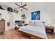 Comfortable bedroom with wood flooring, bright lighting, and decor at 3701 54Th W Dr # 103, Bradenton, FL 34210