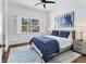 Inviting bedroom with a plush rug, comfortable bed, and plenty of natural light at 3701 54Th W Dr # 103, Bradenton, FL 34210