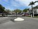 Gated community entrance with black metal gate and well-maintained landscaping, ensuring security and privacy at 3701 54Th W Dr # 103, Bradenton, FL 34210