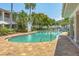 Resort-style pool with lush landscaping and comfortable lounge chairs at 3701 54Th W Dr # 103, Bradenton, FL 34210