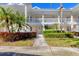 Charming two-story condo with private balconies and a well-manicured walkway and lush tropical foliage at 3701 54Th W Dr # 103, Bradenton, FL 34210