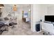 Open concept living area with a view to the dining area and office space, creating a versatile layout at 3701 54Th W Dr # 103, Bradenton, FL 34210