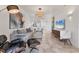 Stylishly designed living room with modern furnishings, open layout and view to the kitchen at 3701 54Th W Dr # 103, Bradenton, FL 34210