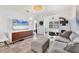 Bright living room with media center, sleek decor, and an open layout for relaxing and entertaining at 3701 54Th W Dr # 103, Bradenton, FL 34210