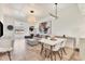 Open-concept living space with modern furniture, neutral tones, and plenty of natural light at 3701 54Th W Dr # 103, Bradenton, FL 34210