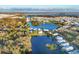 Panoramic aerial view of the property surrounded by a lake and other waterfront homes at 3912 14Th E St, Ellenton, FL 34222