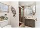 Cozy bathroom featuring tiled shower, vanity, and decorative fixtures at 3912 14Th E St, Ellenton, FL 34222