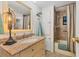 Bright bathroom featuring a bathtub and shower combo with granite vanity at 3912 14Th E St, Ellenton, FL 34222