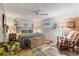 Comfortable bedroom with a ceiling fan, a large bed and colorful rug at 3912 14Th E St, Ellenton, FL 34222