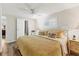 Bright bedroom featuring a ceiling fan, natural light and wood floors at 3912 14Th E St, Ellenton, FL 34222