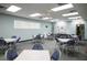 Large community room with tables and chairs, perfect for gatherings and events at 3912 14Th E St, Ellenton, FL 34222
