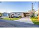 Charming single-story home with well-maintained landscaping, carport, and a screened-in porch at 3912 14Th E St, Ellenton, FL 34222