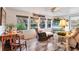 Cozy living room with large windows offering a view of the water, ceiling fan, and hardwood floors at 3912 14Th E St, Ellenton, FL 34222