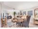 Comfortable living room featuring neutral tones, wood floors, and a cozy seating arrangement at 3912 14Th E St, Ellenton, FL 34222