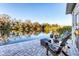 Outdoor patio with seating overlooking a scenic lake at 3912 14Th E St, Ellenton, FL 34222