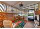 Cozy screened porch featuring outdoor seating, lighting, and floral rug at 3912 14Th E St, Ellenton, FL 34222