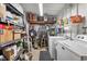Organized utility room with shelving and laundry appliances at 3912 14Th E St, Ellenton, FL 34222