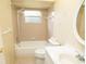 Standard bathroom with tub, toilet, vanity and pink tiles at 4018 Oakhurst Dr # 3181, Sarasota, FL 34233
