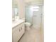 Well-lit bathroom featuring a classic white toilet and a shower with a patterned sliding door at 4018 Oakhurst Dr # 3181, Sarasota, FL 34233