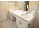Bright bathroom featuring a long vanity with double sinks and ample cabinet storage space at 4018 Oakhurst Dr # 3181, Sarasota, FL 34233
