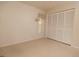 A bedroom features neutral walls, a window with blinds, and a closet with standard doors at 4018 Oakhurst Dr # 3181, Sarasota, FL 34233
