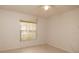 A bedroom features a window with blinds and neutral-toned walls at 4018 Oakhurst Dr # 3181, Sarasota, FL 34233