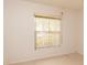 The bedroom features a large window with blinds to filter the natural sunlight at 4018 Oakhurst Dr # 3181, Sarasota, FL 34233