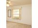 Comfortable bedroom featuring a ceiling fan and neutral decor at 4018 Oakhurst Dr # 3181, Sarasota, FL 34233