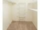 Walk-in closet featuring wire shelving and carpet floors at 4018 Oakhurst Dr # 3181, Sarasota, FL 34233